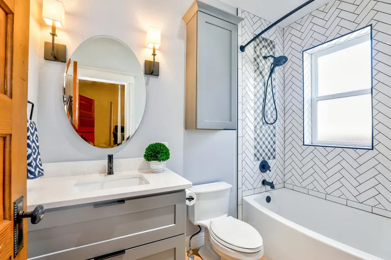 Modern grey shaker bathroom vanity with fitted countertop and matching wall cabinet